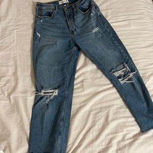 Blue ripped Abercrombie and fitch jeans.